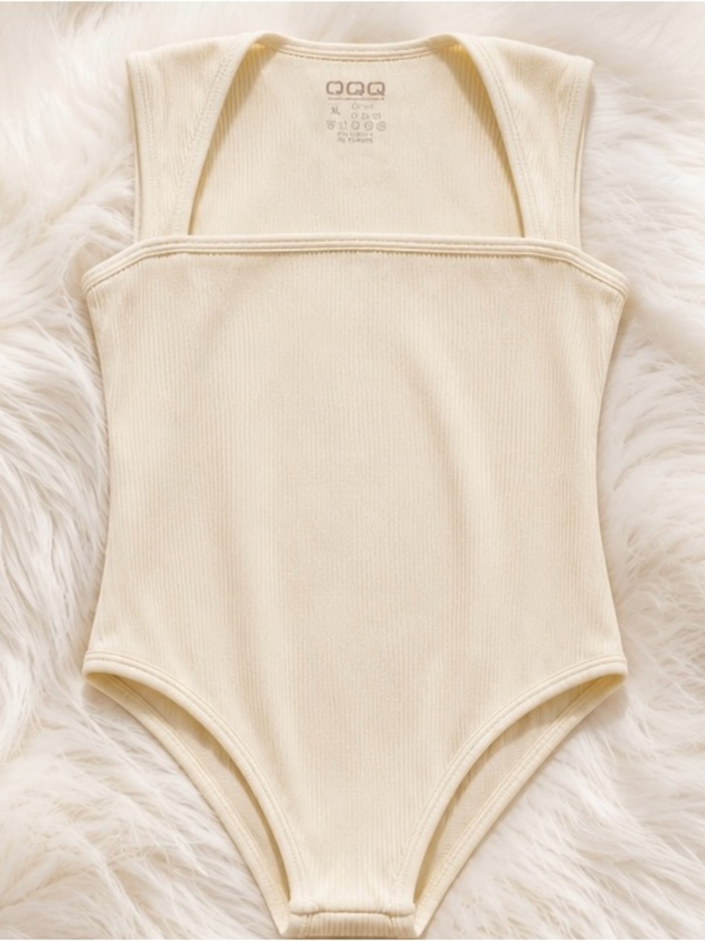 Women’s OQQ Ribbed Bodysuit in Cream
